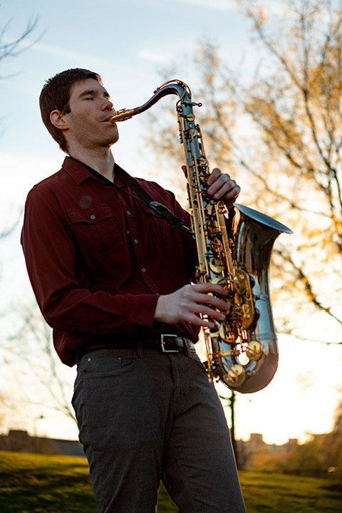 Jon playing saxophone